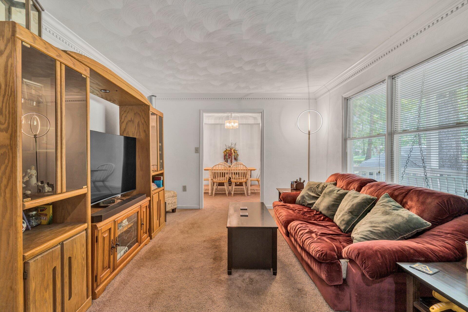 1842 Morris Road Goodview, VA 24095 - Photo 6 of 35 a living room with furniture cabinets and a flat screen tv
