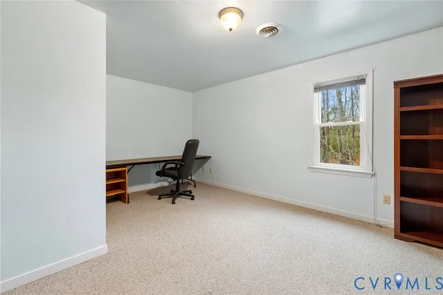 a bench sitting in a room next to a window