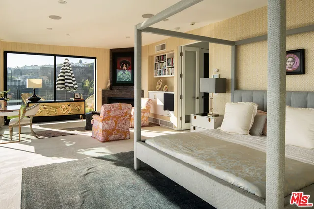 a large white bed in a white room