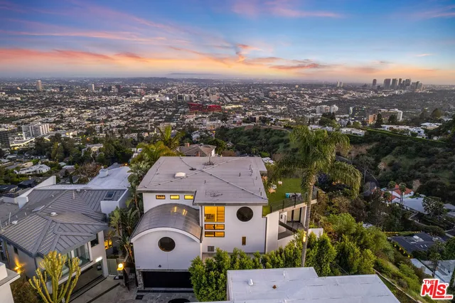 an aerial view of a house with a garden