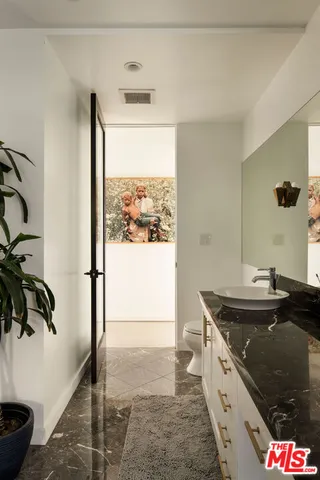 a kitchen with a sink a refrigerator and a stove