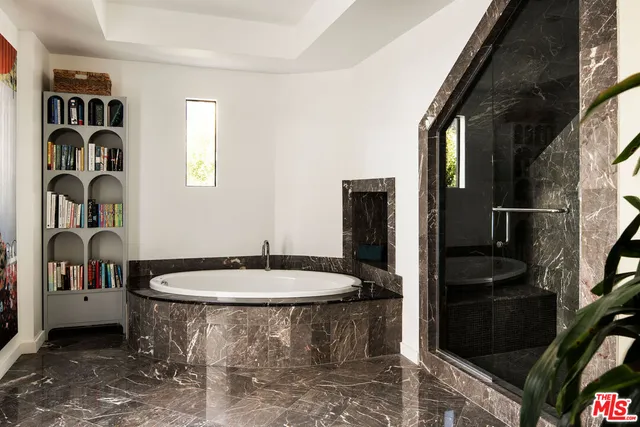 a terrace with outdoor seating and city view