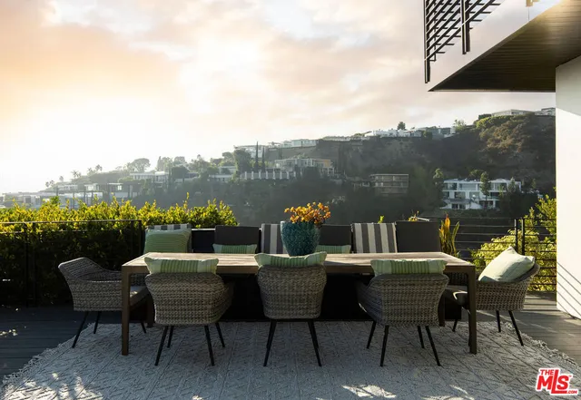 a view of swimming pool with seating space