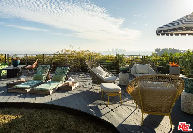 a view of a chairs and table on the terrace