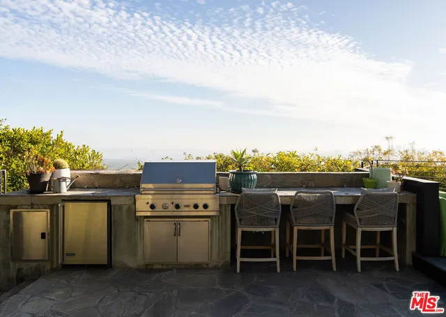 a front view of a building with outdoor seating