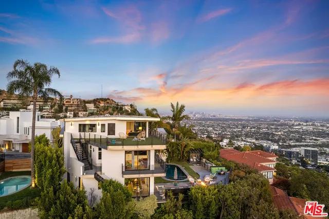 an aerial view of a residential apartment building with a yard