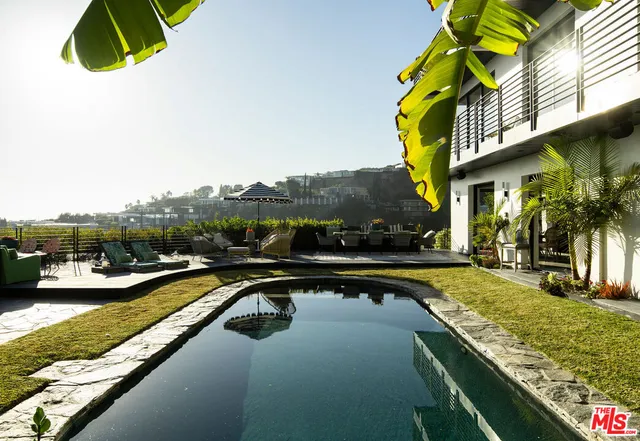 a view of swimming pool from a balcony