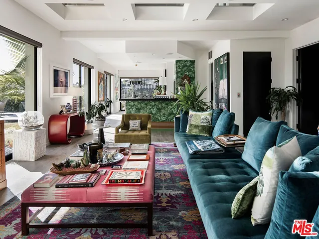 a living room with furniture and a rug