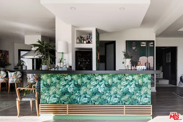 a view of living room filled with furniture and floor to ceiling window