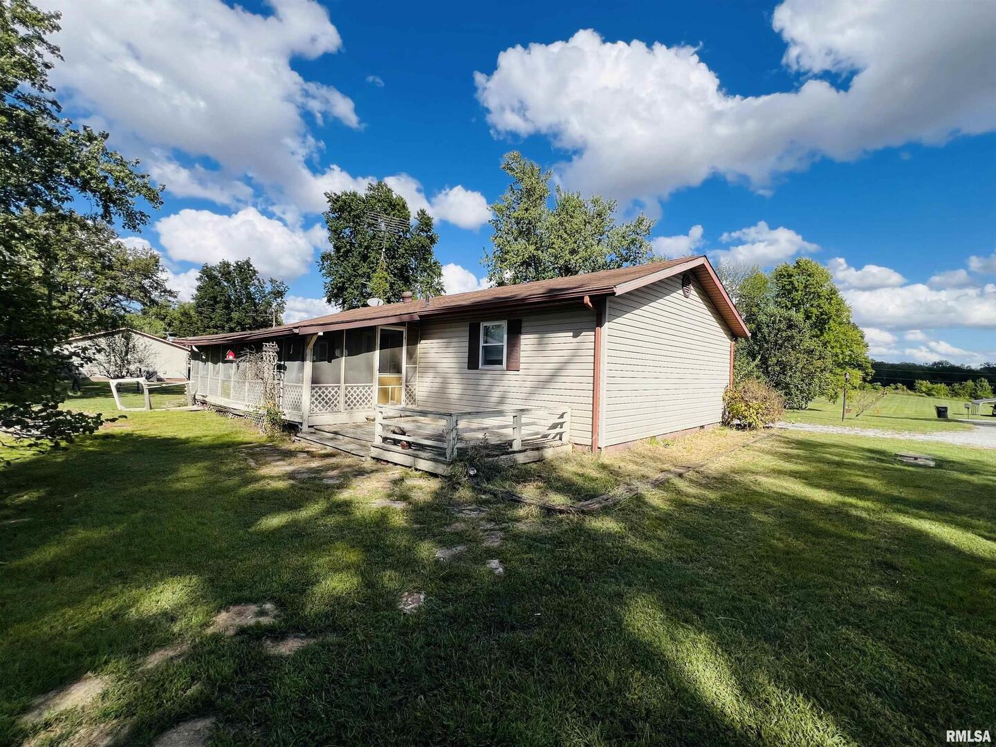 295 Country Acres Road Eldorado, IL 62930 - Photo 11 of 32 a view of a house with a backyard