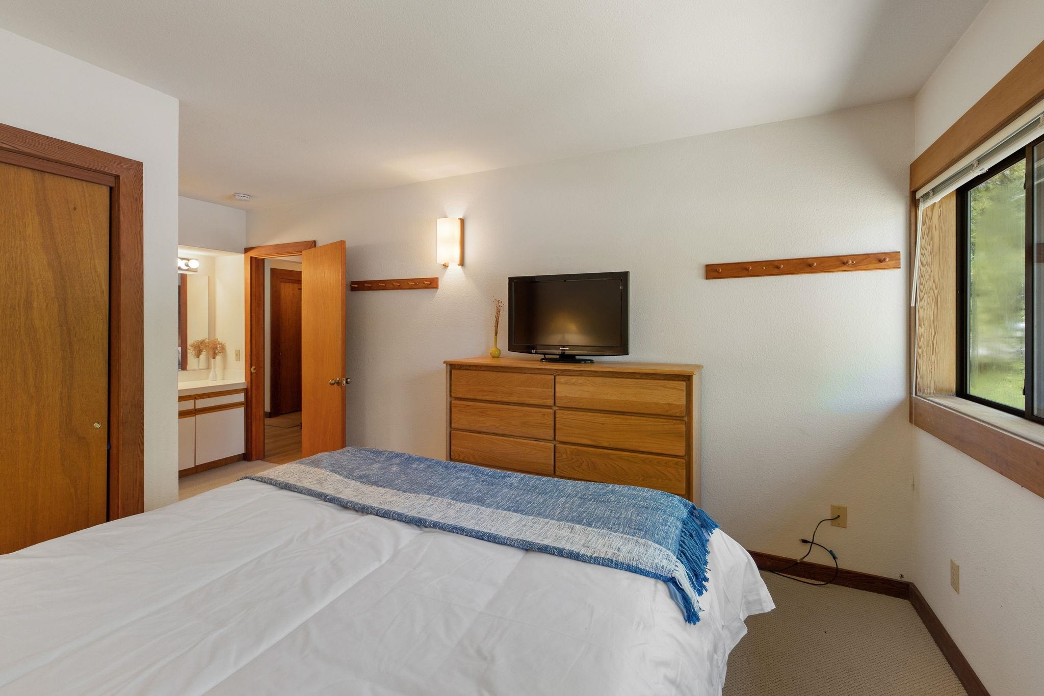 1591 Olympic Vly Road, Unit 29 Olympic Valley, CA 96146 - Photo 15 of 28 a bedroom with a bed and furniture