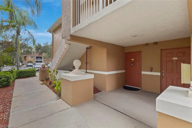 a kitchen with a sink a stove and cabinets