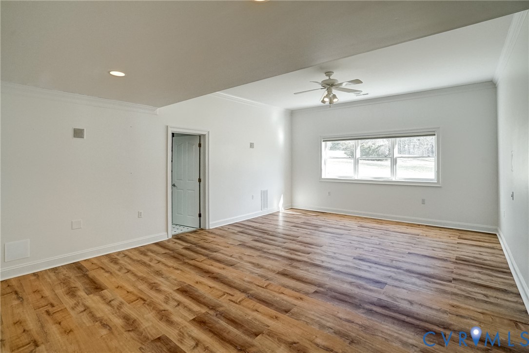 721 Meadow View Ridge Manakin-Sabot, VA 23103 - Photo 42 of 45 a view of empty room with wooden floor and fan