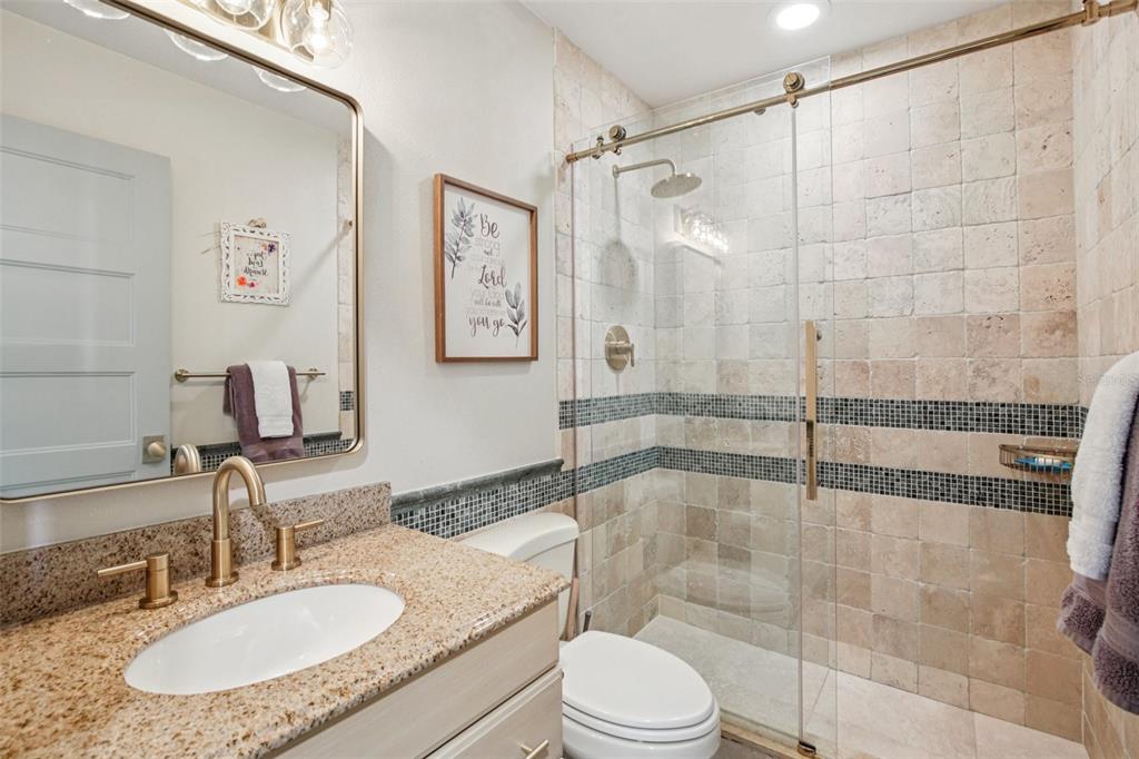 3390 Bayou Sound Longboat Key, FL 34228 - Photo 10 of 59 a bathroom with a granite countertop sink mirror toilet and bathtub