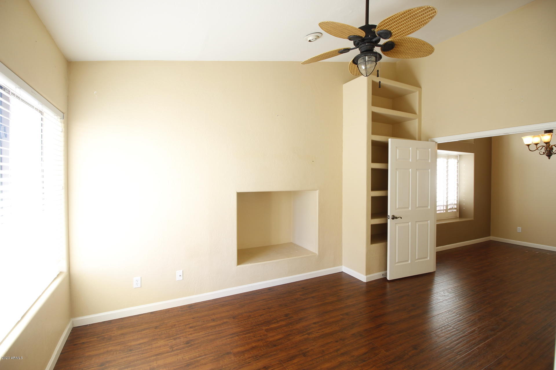 1611 West Del Rio Street Chandler, AZ 85224 - Photo 11 of 38 a view of empty room with wooden floor and fan