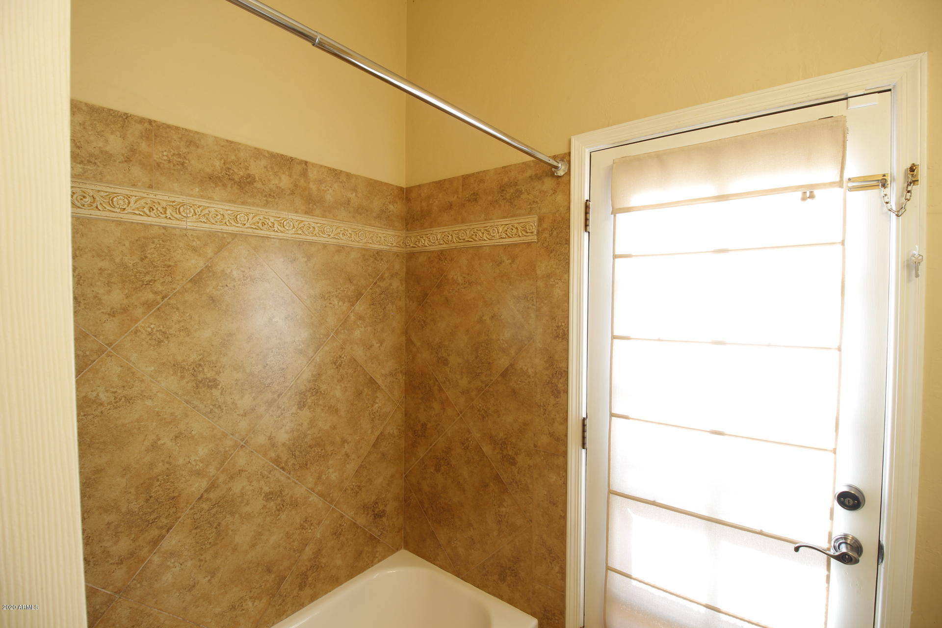 1611 West Del Rio Street Chandler, AZ 85224 - Photo 14 of 38 a bathroom with a glass shower door
