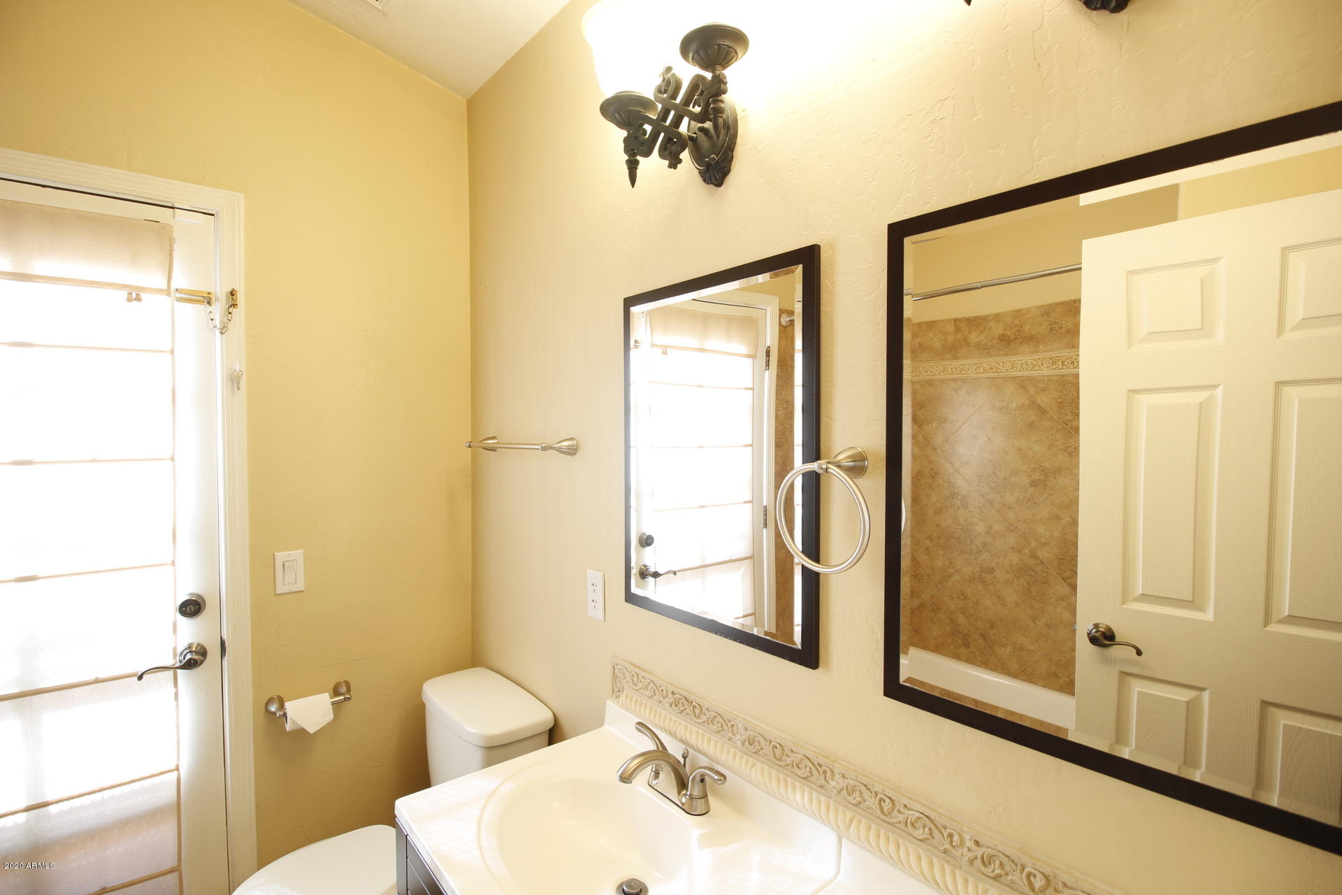 1611 West Del Rio Street Chandler, AZ 85224 - Photo 15 of 38 a bathroom with a sink and a mirror