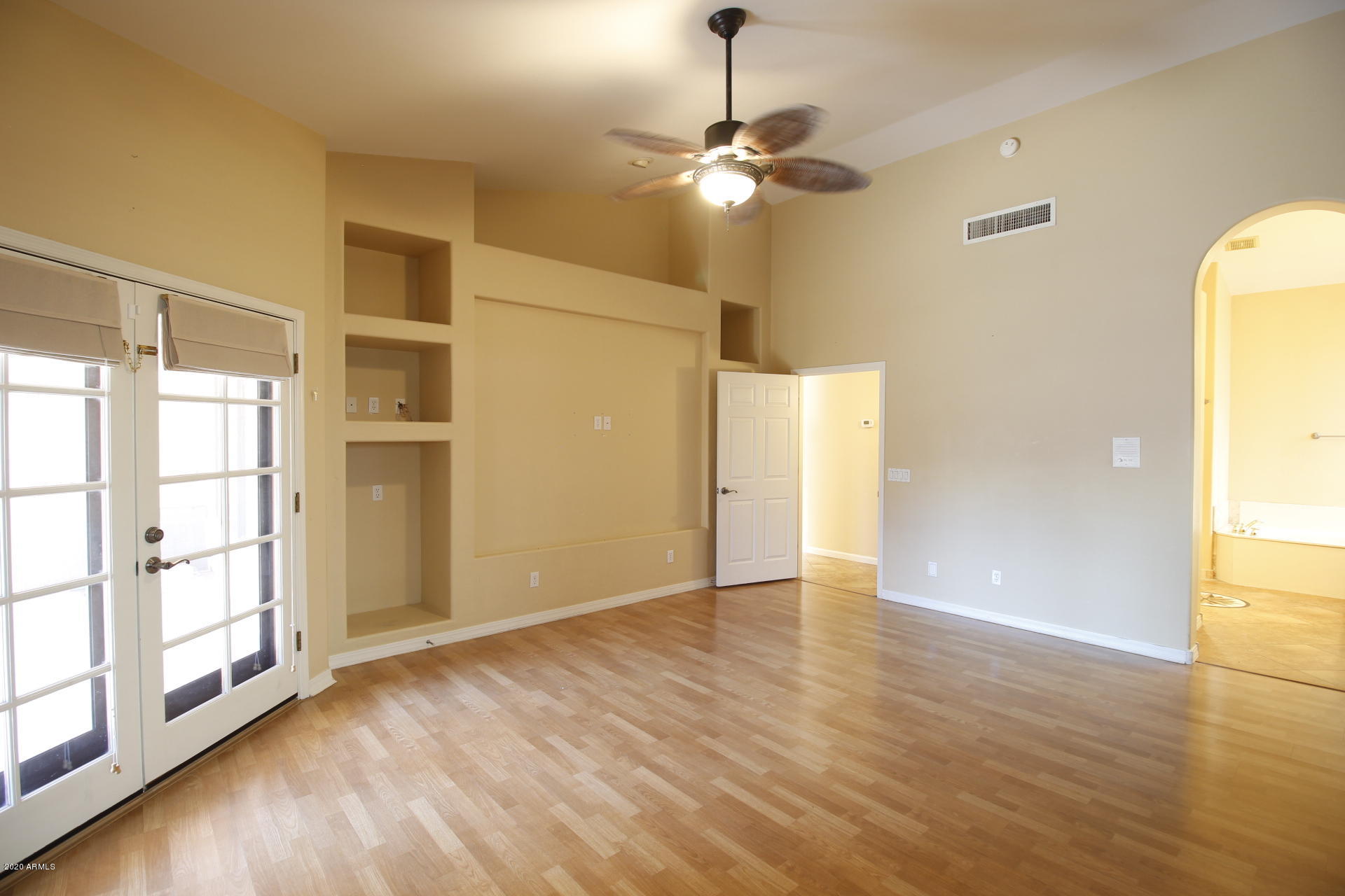 1611 West Del Rio Street Chandler, AZ 85224 - Photo 24 of 38 a view of an empty room with window and wooden floor