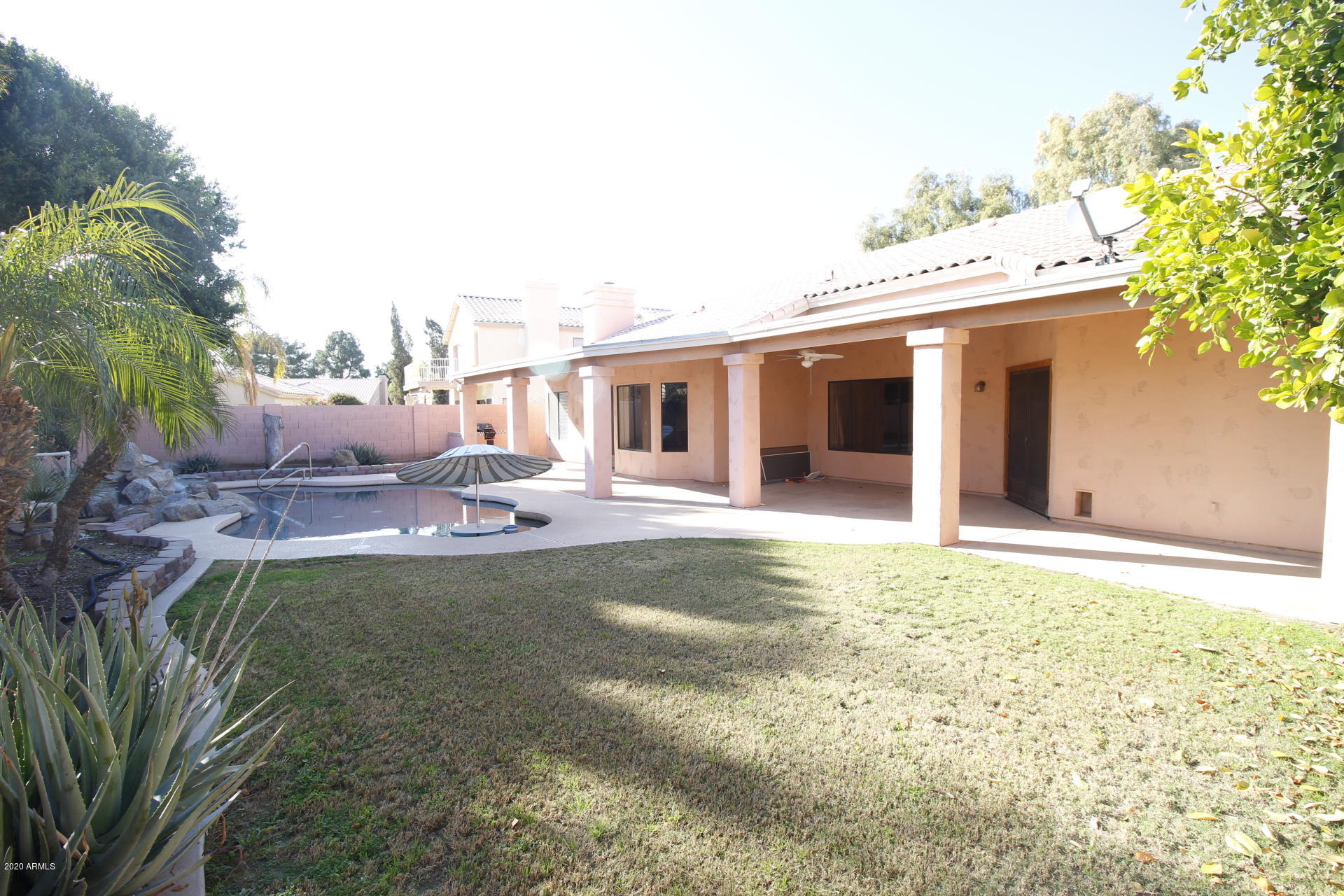 1611 West Del Rio Street Chandler, AZ 85224 - Photo 33 of 38 a swimming pool with outdoor seating and yard