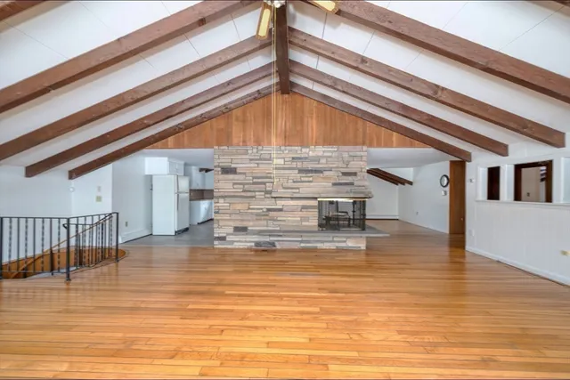 a view of kitchen and hall with wooden floor
