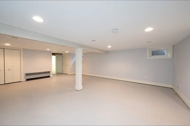 an empty room with a empty space and windows