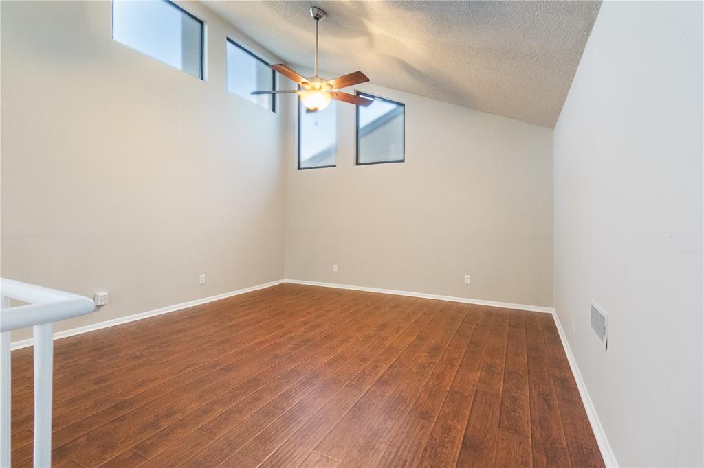 9611 Baseline Drive Dallas, TX 75243 - Photo 15 of 21 a view of an empty room with wooden floor
