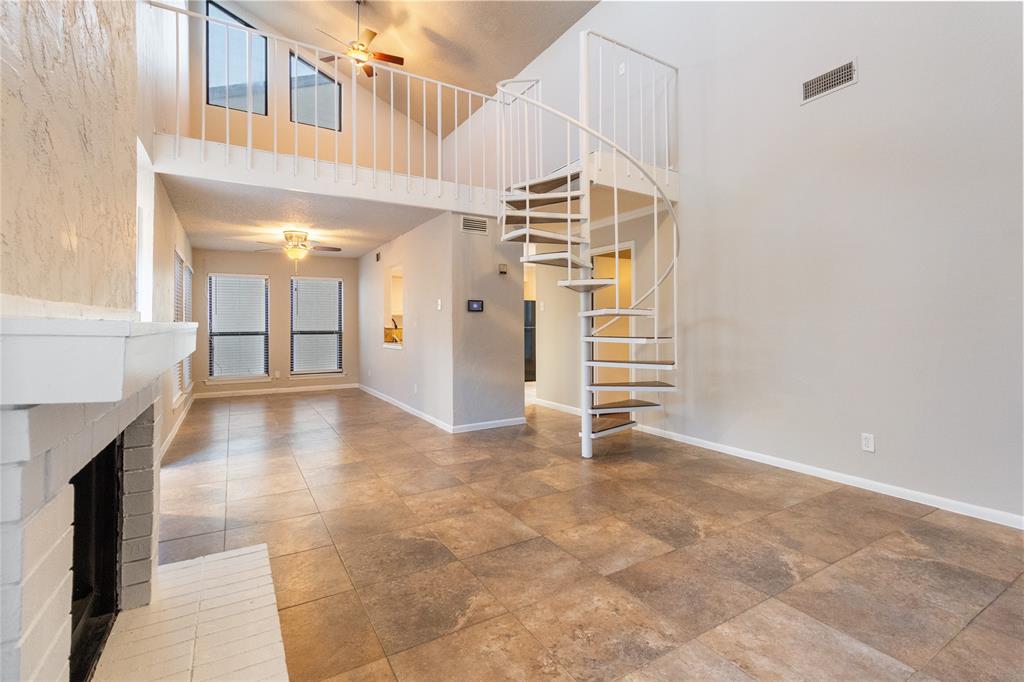 9611 Baseline Drive Dallas, TX 75243 - Photo 17 of 21 a view of an empty room with a fireplace