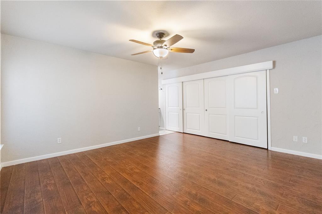 9611 Baseline Drive Dallas, TX 75243 - Photo 6 of 21 a view of an empty room with wooden floor