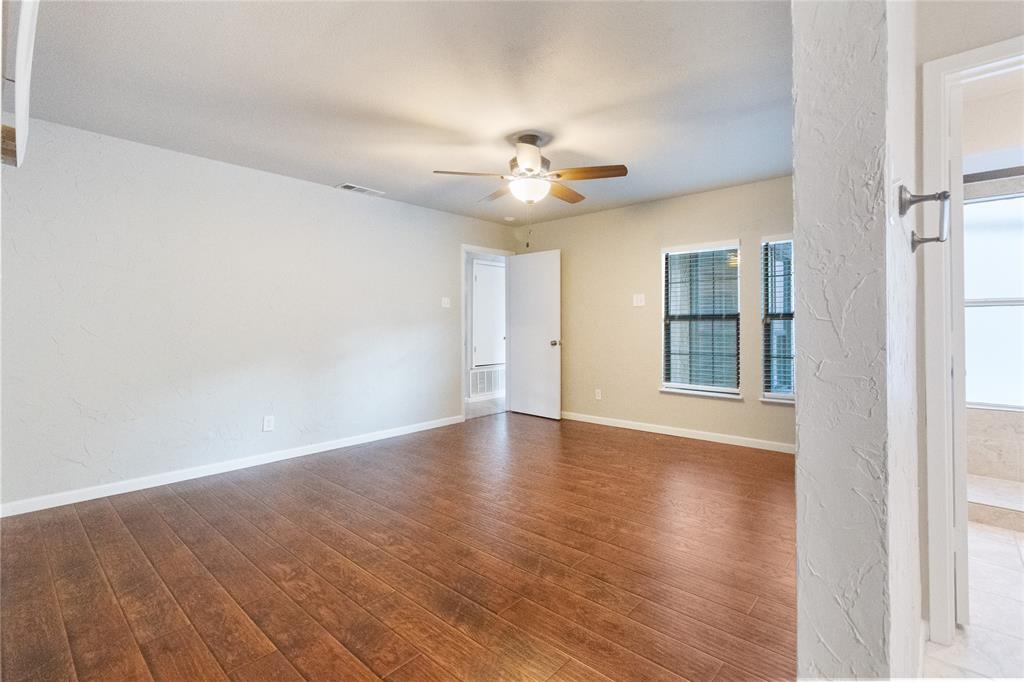 9611 Baseline Drive Dallas, TX 75243 - Photo 8 of 21 wooden floor in an empty room with a window