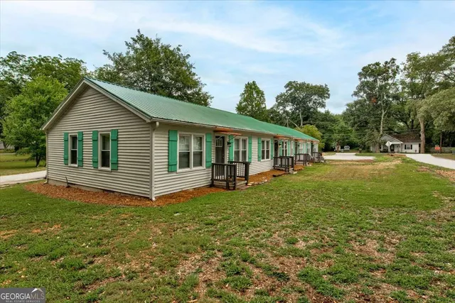 a view of outdoor space with deck and trees