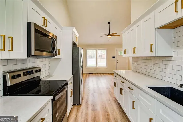 a kitchen with a stove and a microwave