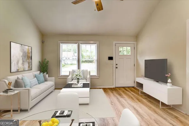 a spacious bedroom with a bed and couch