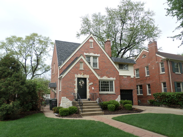 534 Byrd Road Riverside, IL 60546 - Photo 1 of 23 a front view of a house with a yard and green space