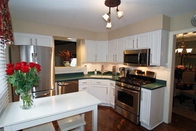 534 Byrd Road Riverside, IL 60546 - Photo 6 of 23 a kitchen with kitchen island granite countertop stainless steel appliances a sink stove and microwave