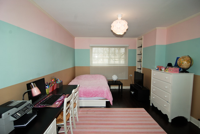 534 Byrd Road Riverside, IL 60546 - Photo 9 of 23 a bedroom with a bed and a chandelier