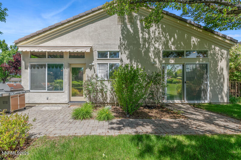 403 Sierra Leaf Circle Reno, NV 89511 - Photo 2 of 25 a front view of a house with garden