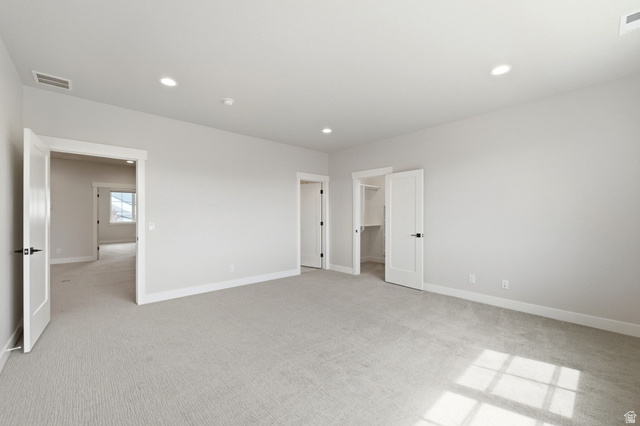 496 North Farmhouse Way, Unit 11 Midway, UT 84049 - Photo 37 of 50 Spacious room with light gray carpeting and white walls