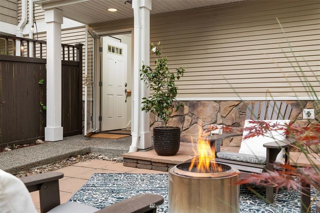 a table with a vase and flowers on it