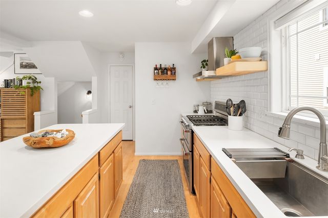 a kitchen that has a sink and cabinets