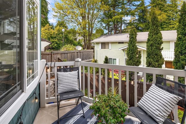 a view of a balcony with wooden floor