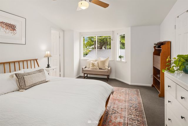 a bedroom with a bed and a couch