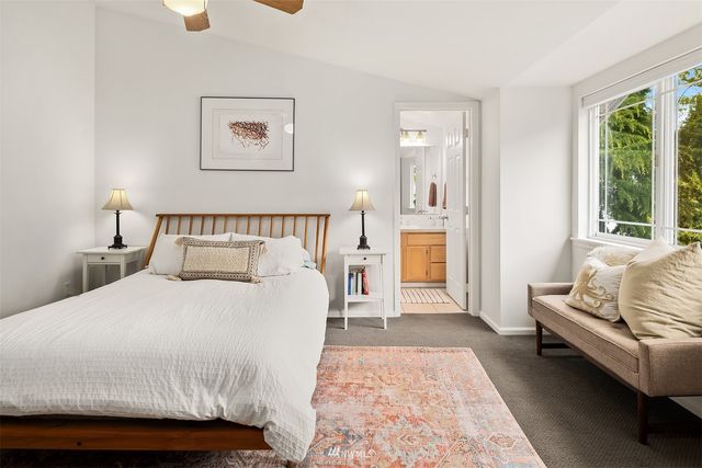 a bedroom with a bed and a couch