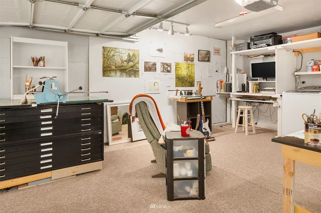 a kitchen with stainless steel appliances kitchen island granite countertop a stove and cabinets