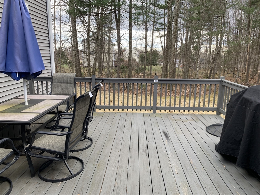 5 Debbie Drive Spencer, MA 01562 - Photo 28 of 30 a view of balcony with wooden floor and outdoor seating