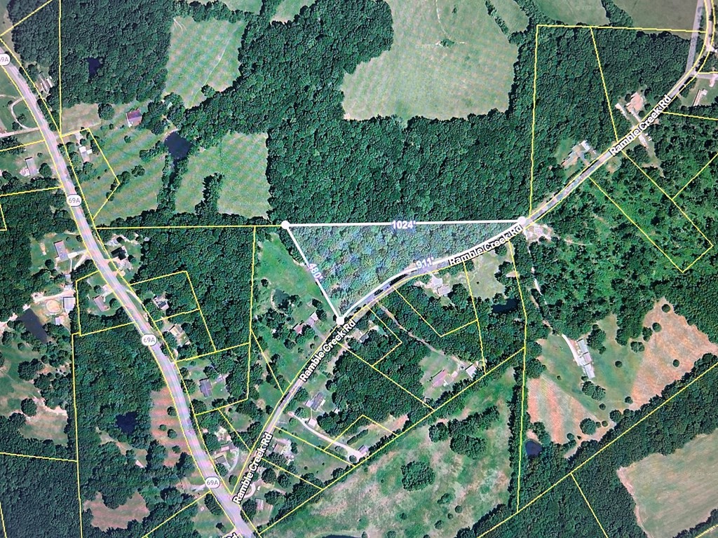 205 Ramble Creek Road Big Sandy, TN 38221 - Photo 2 of 3 an aerial view of houses with yard