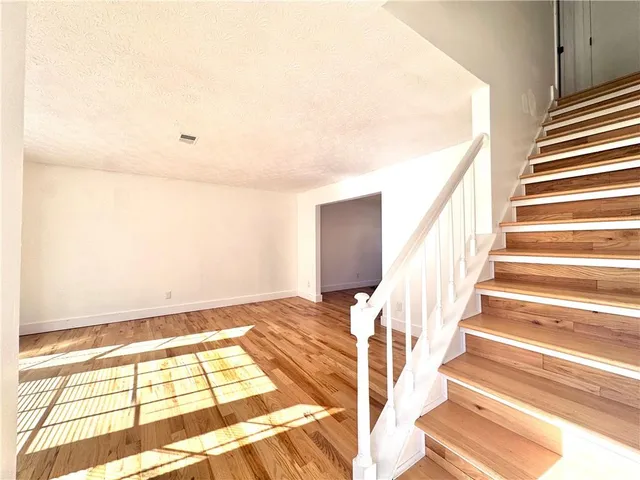 a view of entryway with wooden floor