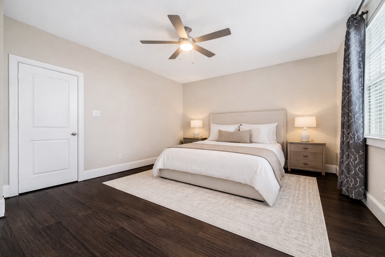 8318 Ginger Oak Street Houston, TX 77055 - Photo 14 of 20 a bedroom with a bed and a ceiling fan