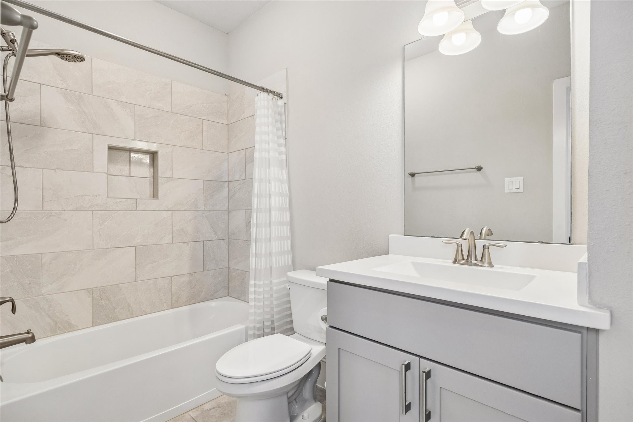 8318 Ginger Oak Street Houston, TX 77055 - Photo 15 of 20 a bathroom with a sink toilet vanity and shower