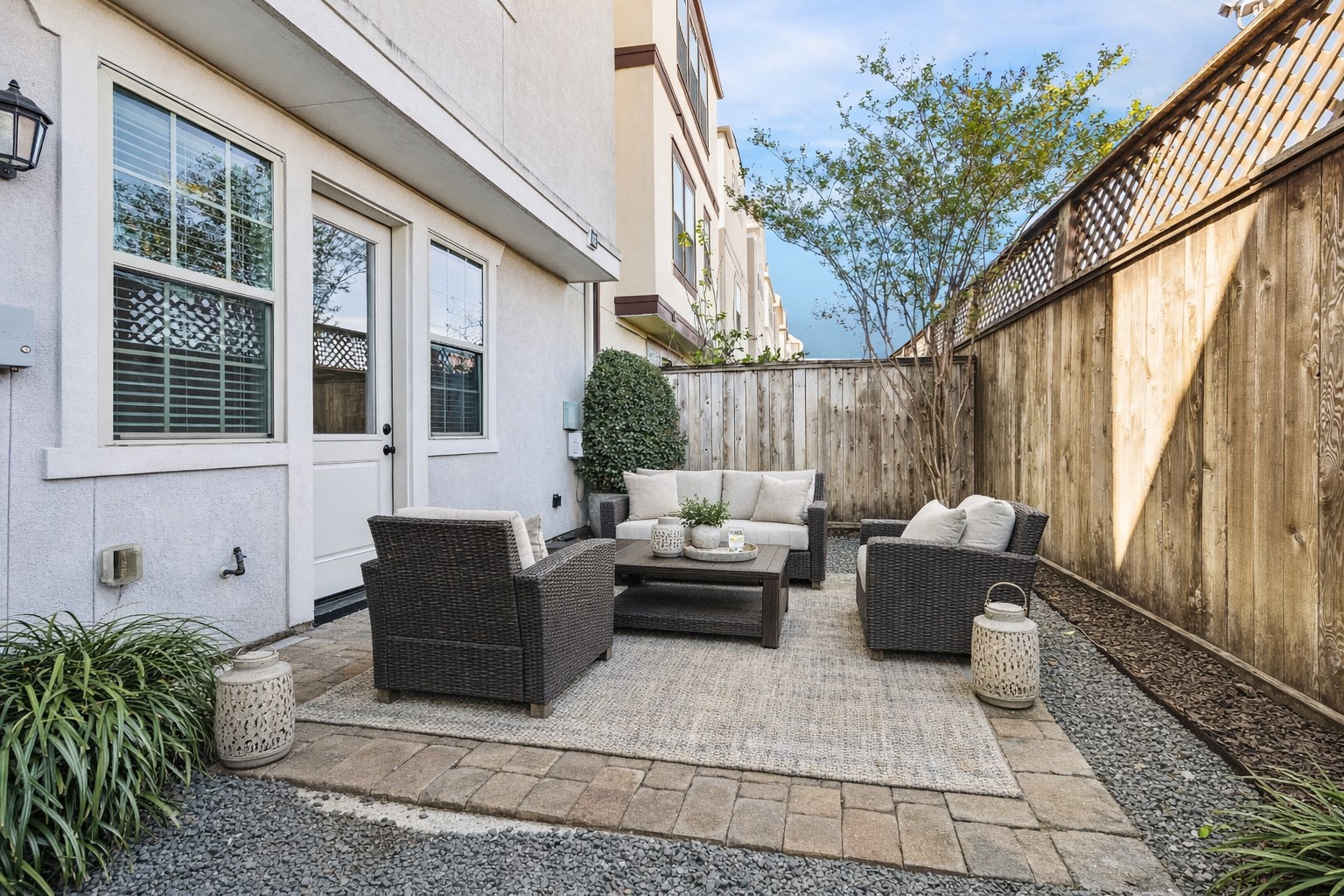 8318 Ginger Oak Street Houston, TX 77055 - Photo 18 of 20 a backyard of a house with sofas fire pit and outdoor seating