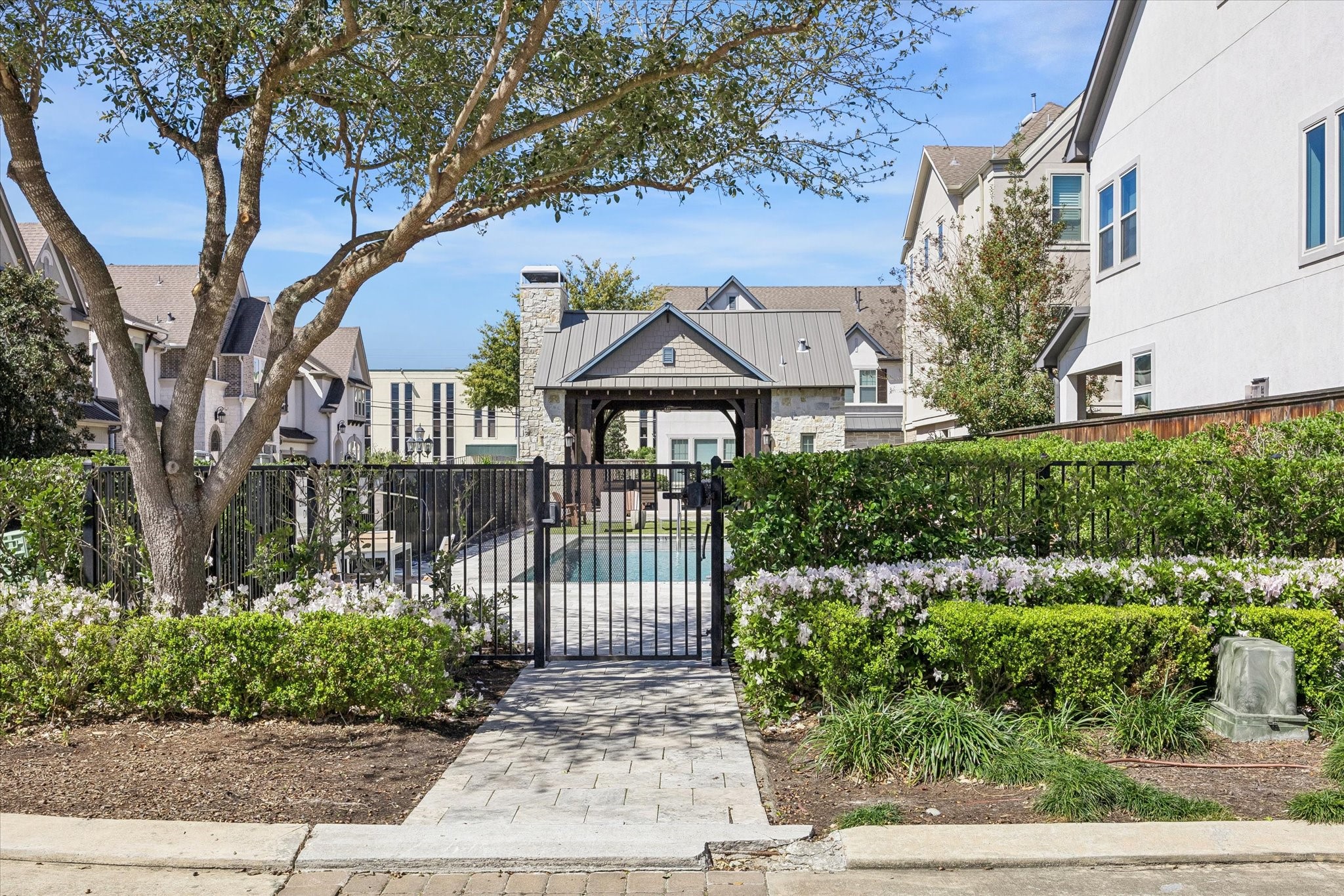 8318 Ginger Oak Street Houston, TX 77055 - Photo 19 of 20 a front view of a house with a garden